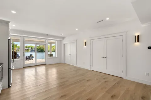 a kitchen with stainless steel appliances a refrigerator and a stove top oven
