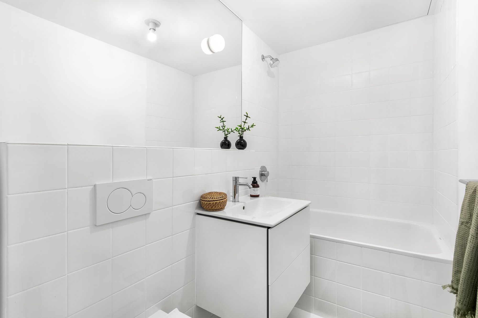 272 Greene Avenue Brooklyn, NY 11238 - Photo 15 of 22 a bathroom with a sink a toilet and shower