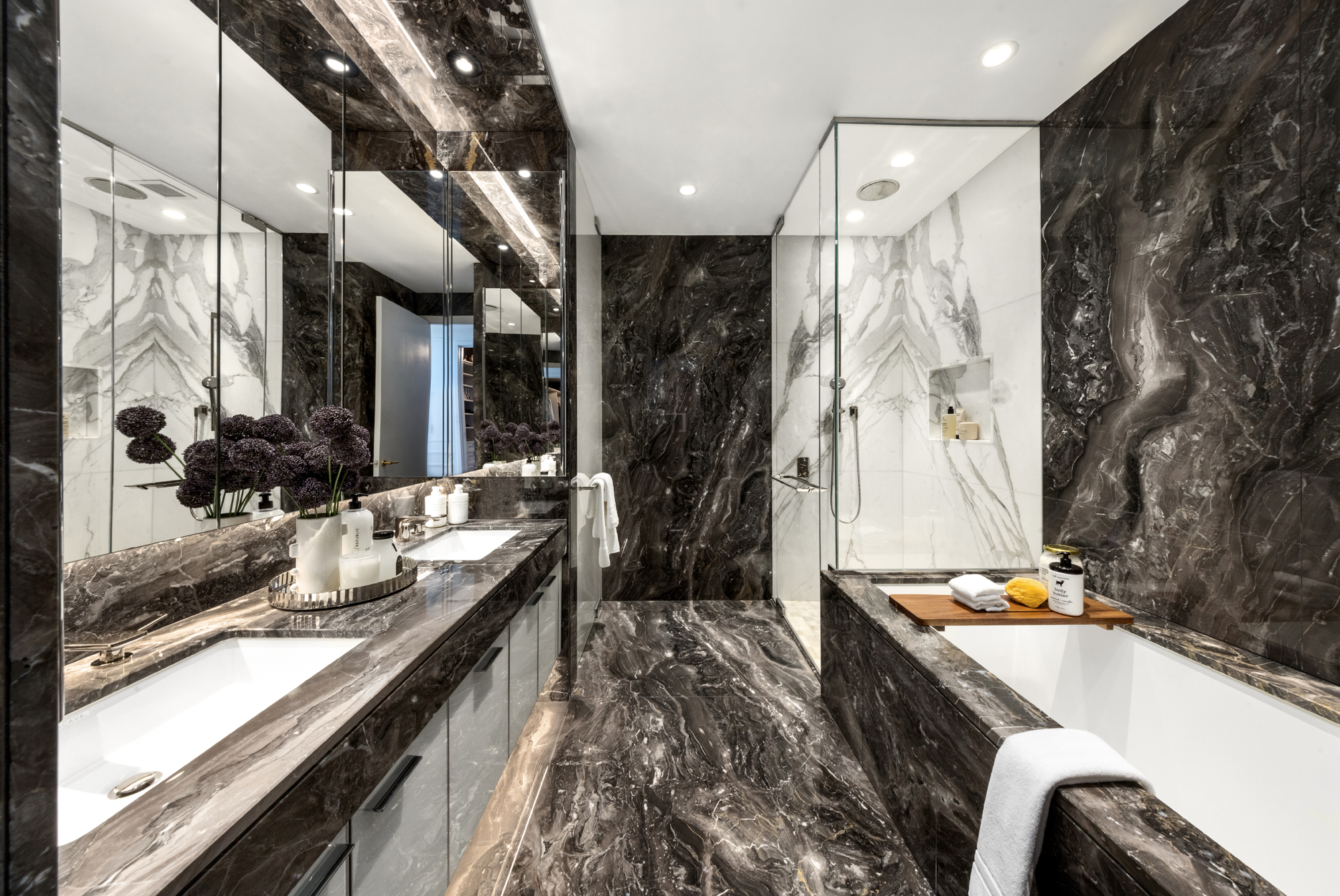 217 West 57th Street, Unit 34F Manhattan, NY 10019 - Photo 10 of 25 a kitchen with blue cabinets and outdoor space