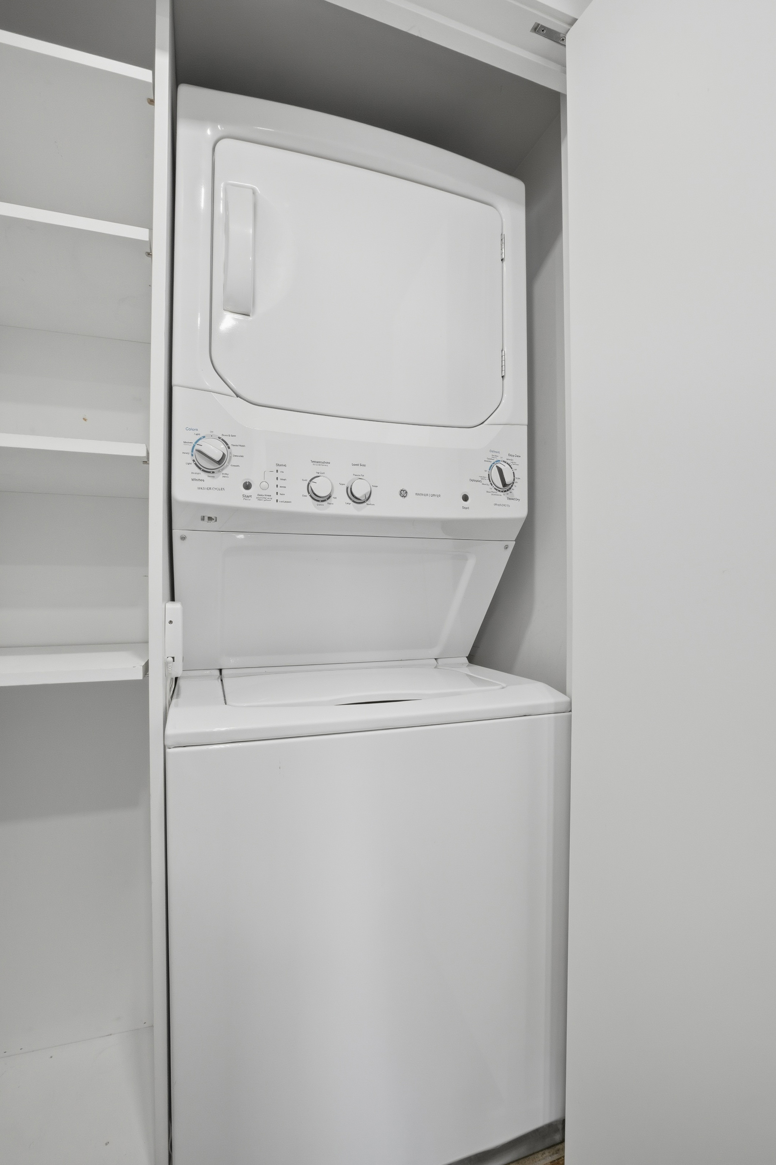 309 East 49th Street, Unit 21A Manhattan, NY 10017 - Photo 14 of 18 a utility room with dryer and washer