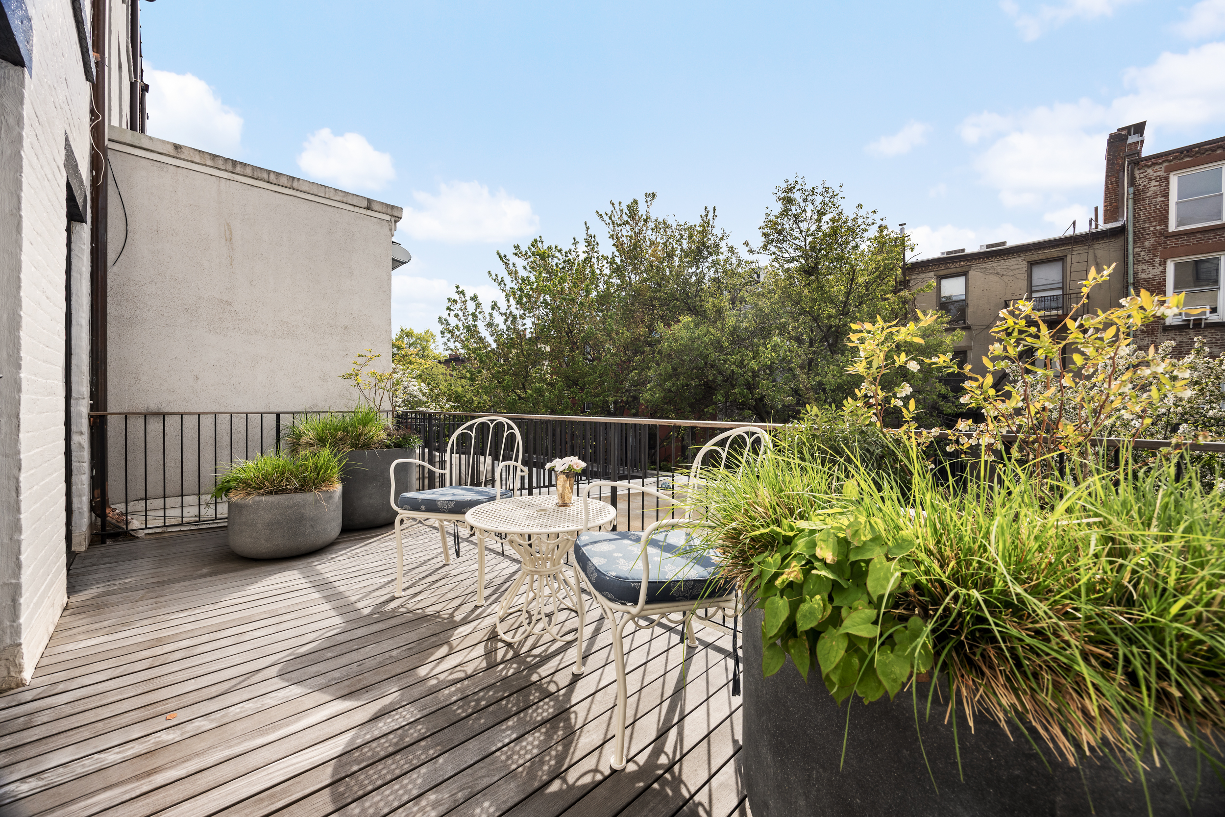 40 Garden Place Brooklyn, NY 11201 - Photo 14 of 33 a view of a deck with furniture and floor to ceiling window