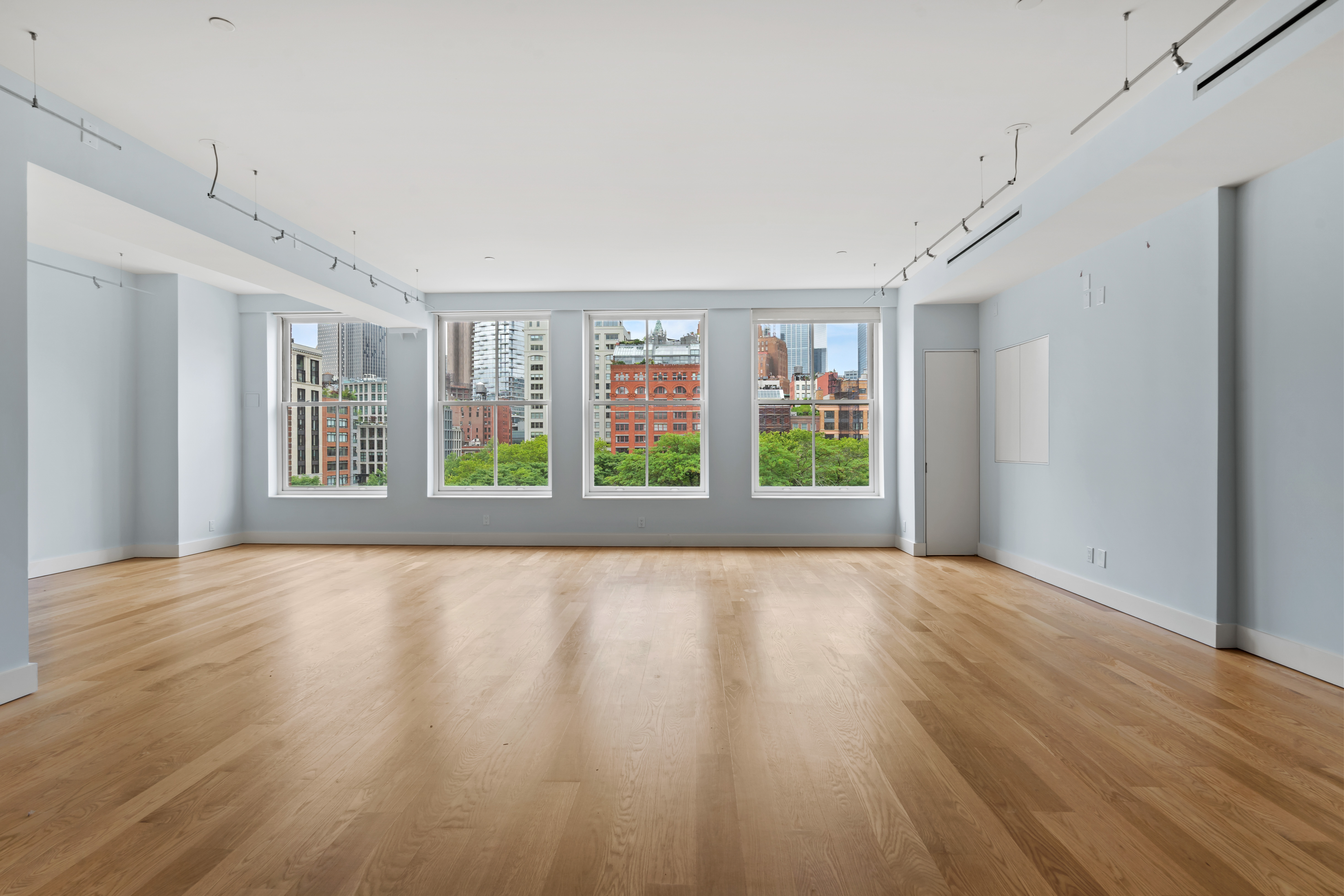 32 Laight Street, Unit 5 Manhattan, NY 10013 - Photo 2 of 31 a view of an empty room with wooden floor and a window