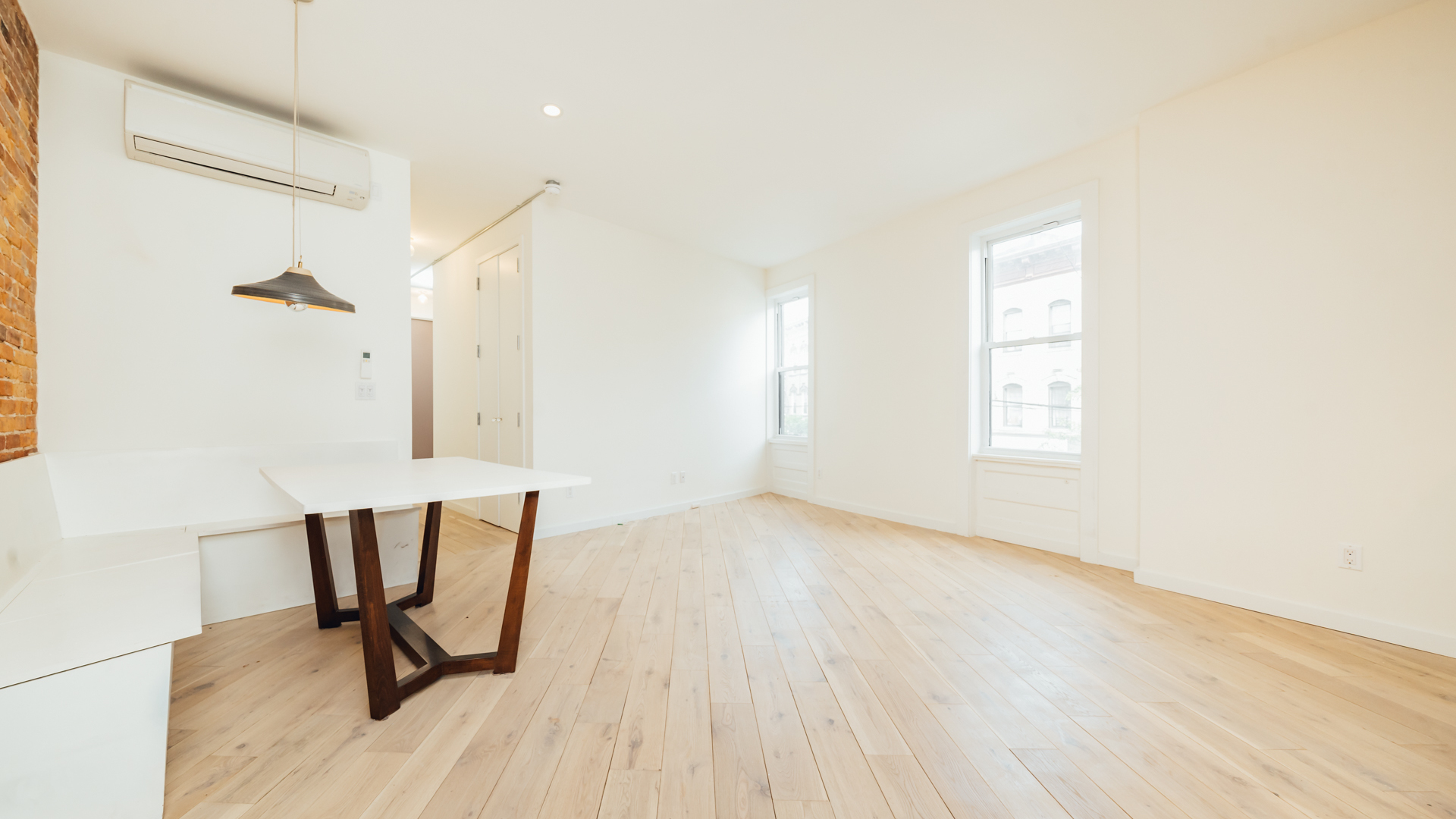 880 Woodward Avenue, Unit 2 Queens, NY 11385 - Photo 12 of 18 a view of a room with wooden floor and a window