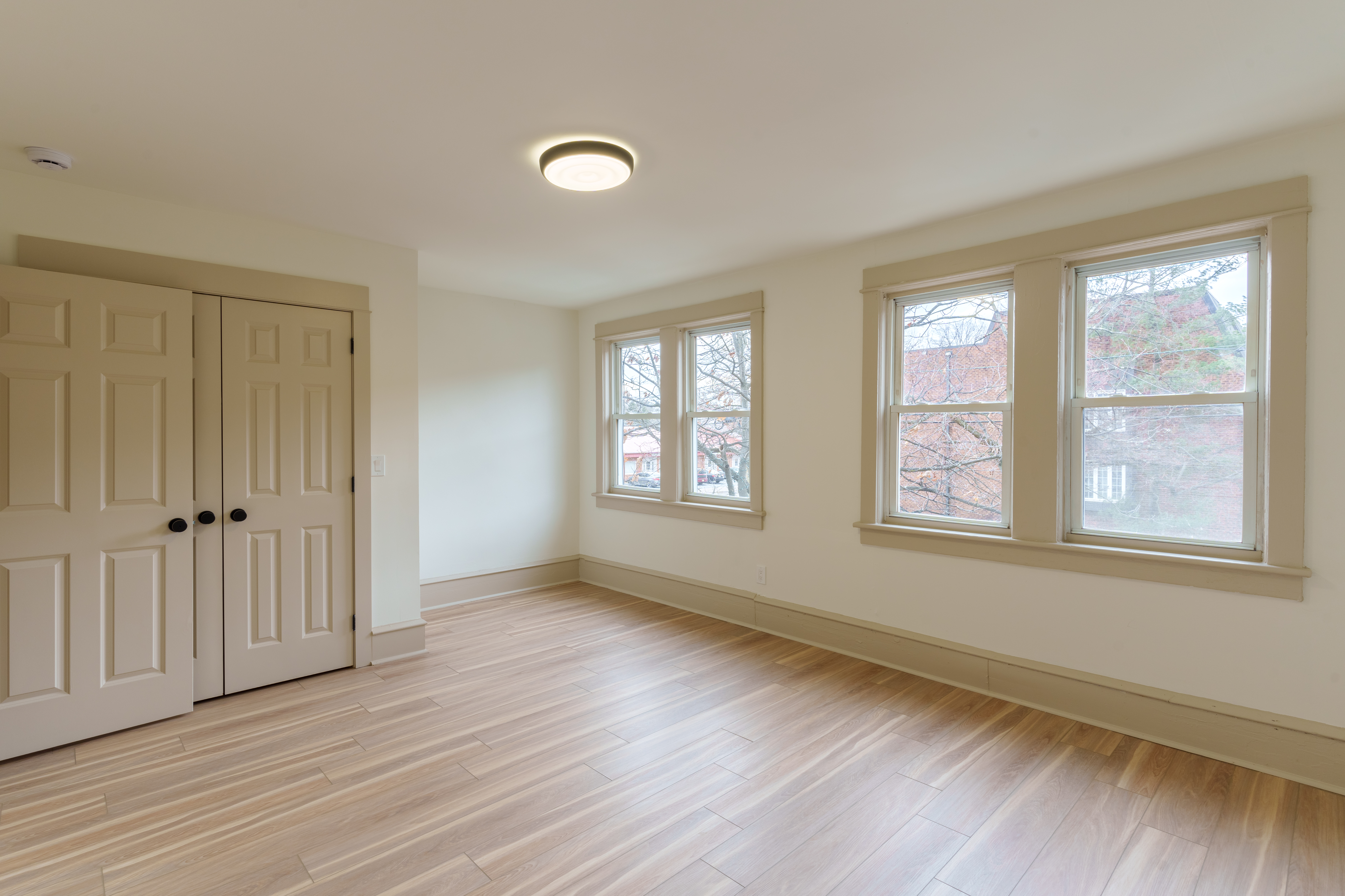 423 North Haddon Avenue Haddonfield, NJ 08033 - Photo 10 of 16 a view of an empty room with wooden floor and a window