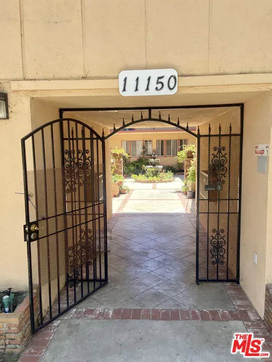 a view of a shop with parking area