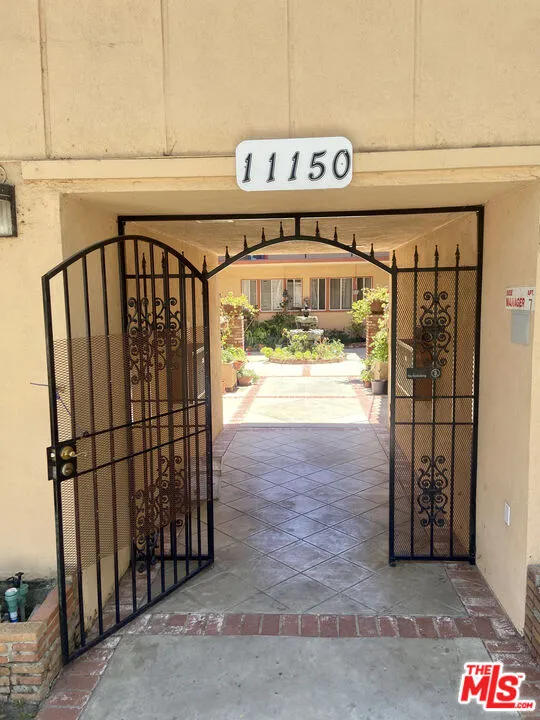 11150 Regent Street Los Angeles, CA 90034 - Photo 11 of 16 a view of a shop with parking area