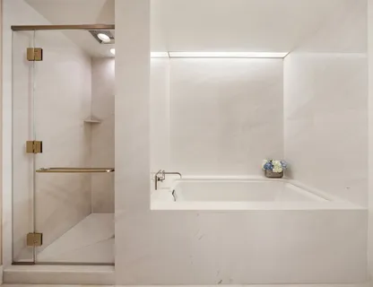 a bathroom with a bathtub and a shower