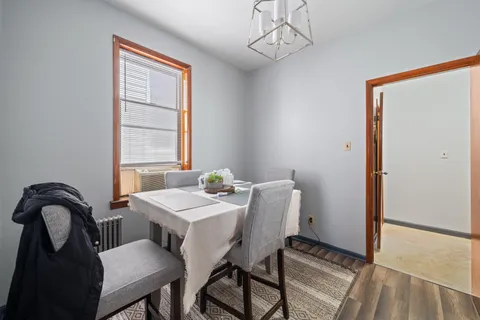 a view of a dining room with furniture and window