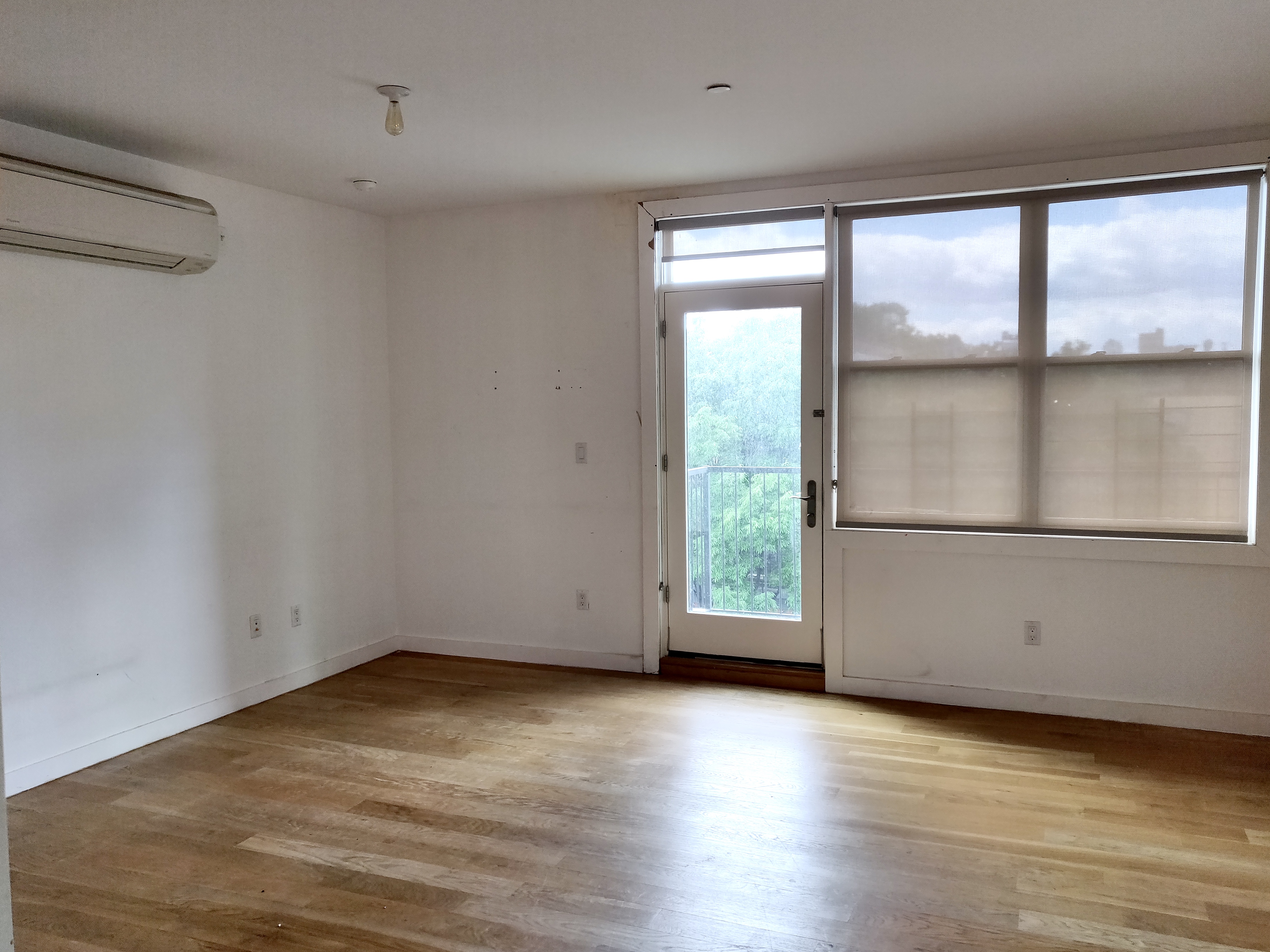 1149 Bedford Avenue, Unit 4A Brooklyn, NY 11216 - Photo 3 of 9 wooden floor in an empty room with a window