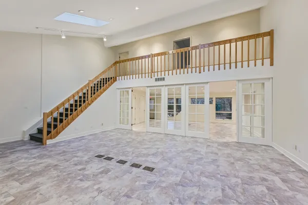 a view of an entryway with wooden floor