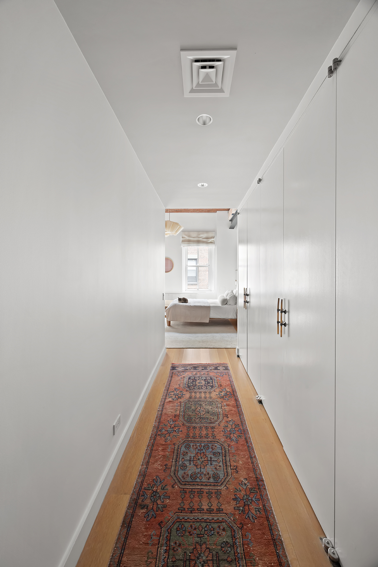63 Greene Street, Unit PHB Manhattan, NY 10012 - Photo 13 of 17 a view of a hallway with wooden floor