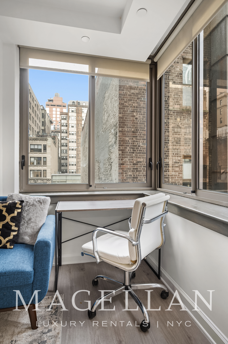 35 West 33rd Street, Unit 4B Manhattan, NY 10001 - Photo 4 of 17 a work room with furniture and a window