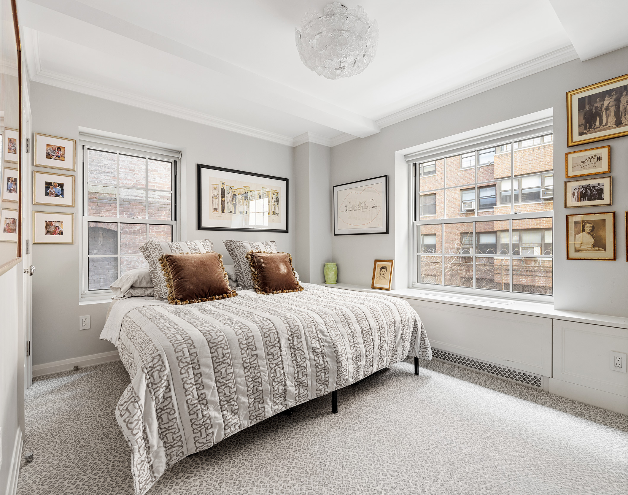 12 East 88th Street, Unit 2D Manhattan, NY 10128 - Photo 6 of 15 a bedroom with a large bed and a window