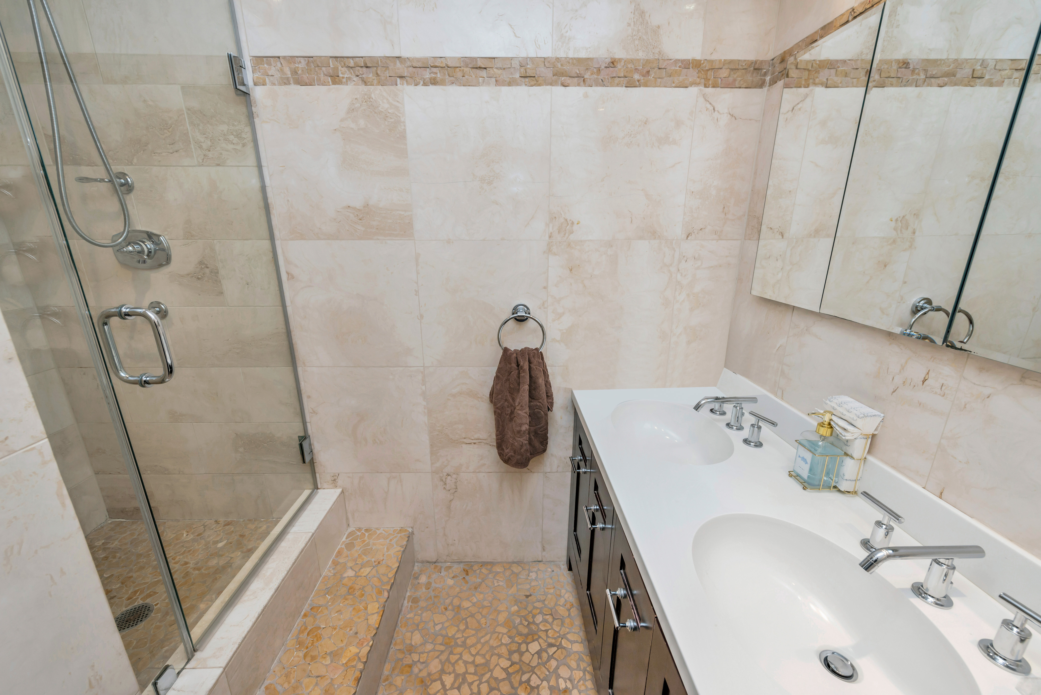175 West 12th Street, Unit 12F Manhattan, NY 10011 - Photo 7 of 10 a bathroom with a sink and shower