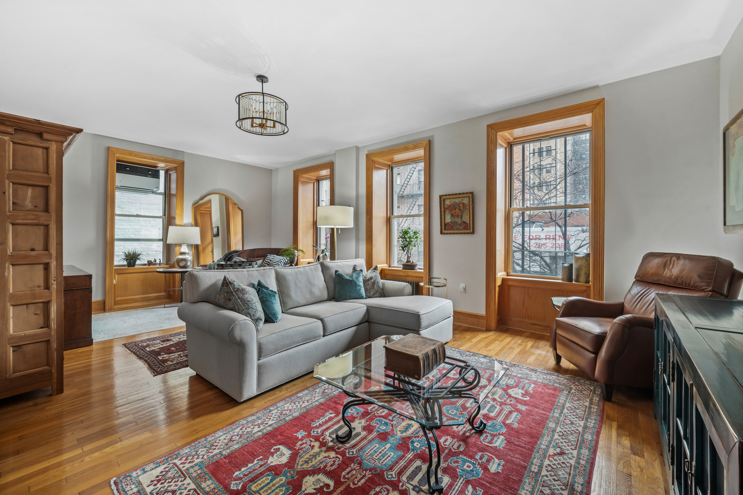 300 West 109th Street, Unit 2JK Manhattan, NY 10025 - Photo 2 of 18 a living room with furniture and a large window
