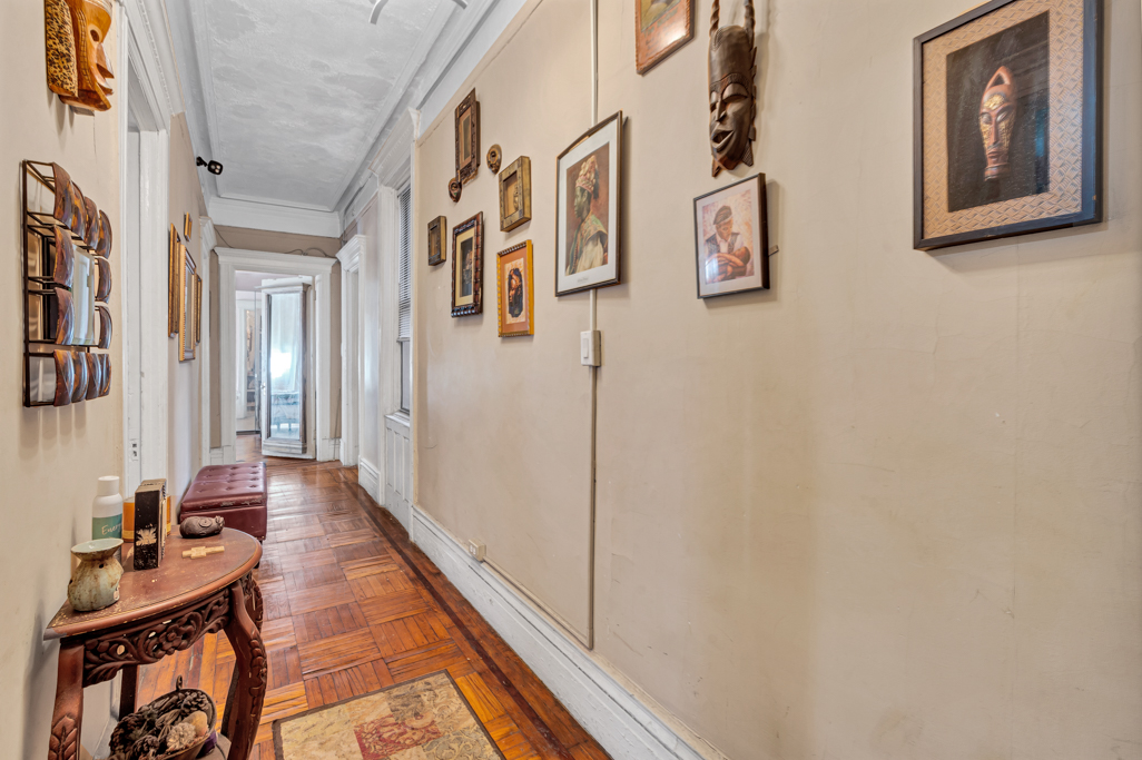 35 Mt Morris Park West, Unit 3E Manhattan, NY 10027 - Photo 8 of 9 a hallway with furniture and wooden floor