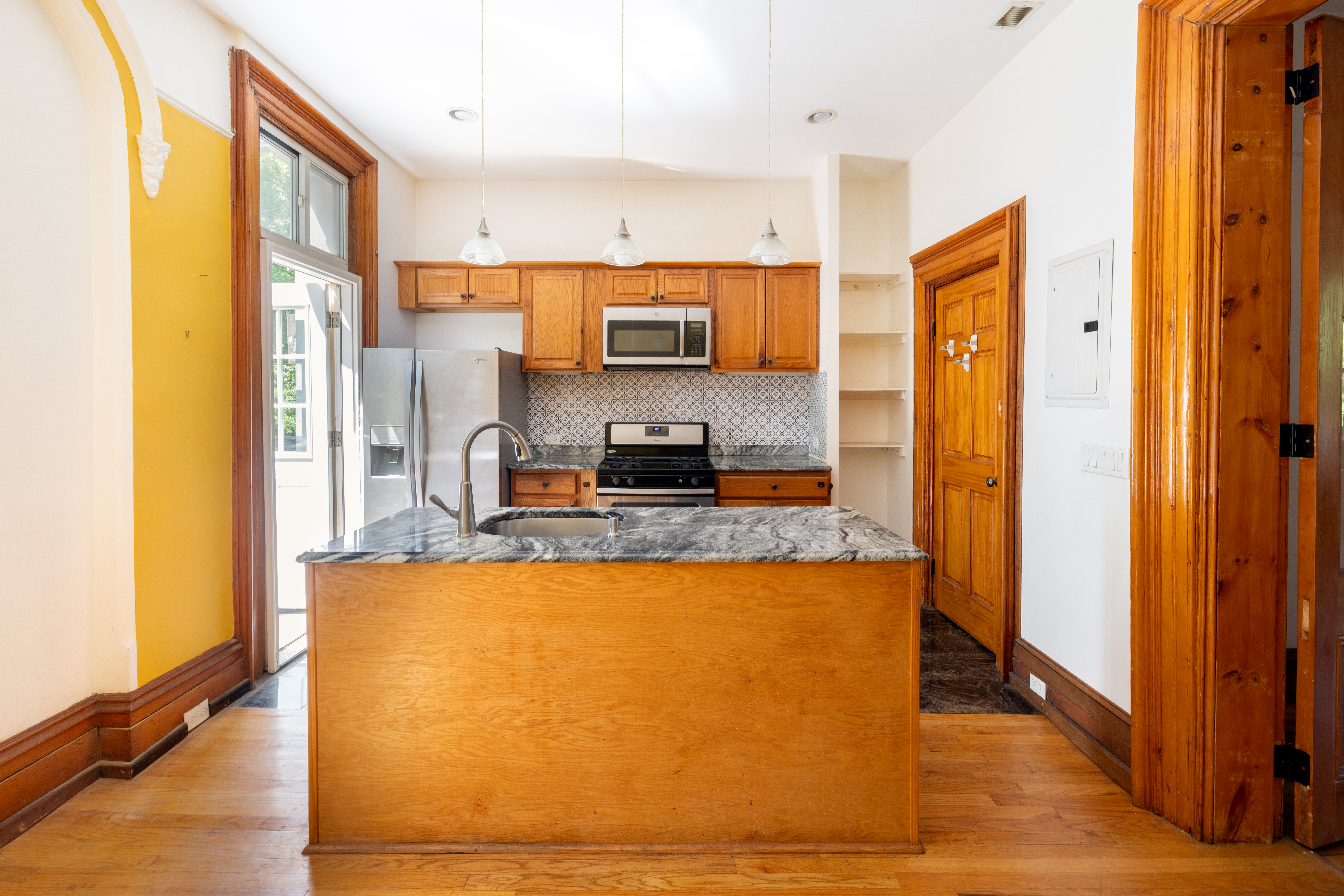 590 Monroe Street Brooklyn, NY 11221 - Photo 20 of 35 a large kitchen with stainless steel appliances granite countertop a refrigerator and a stove