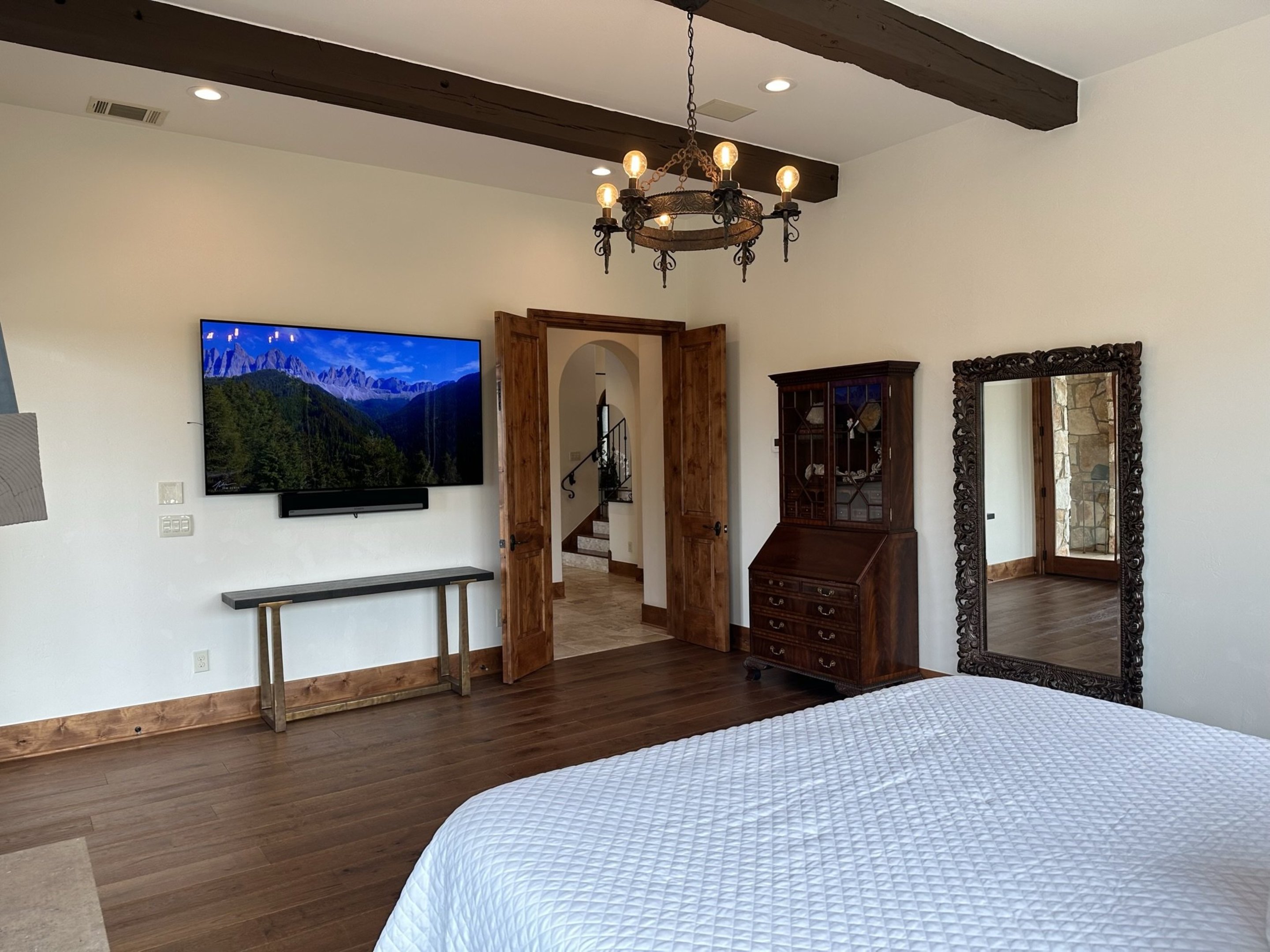 808 Rivercliff Drive Spicewood, TX 78669 - Photo 47 of 71 a bedroom with a bed and a flat screen tv