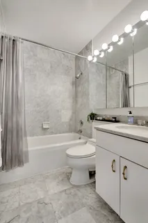a bathroom with a sink a toilet and a bathtub