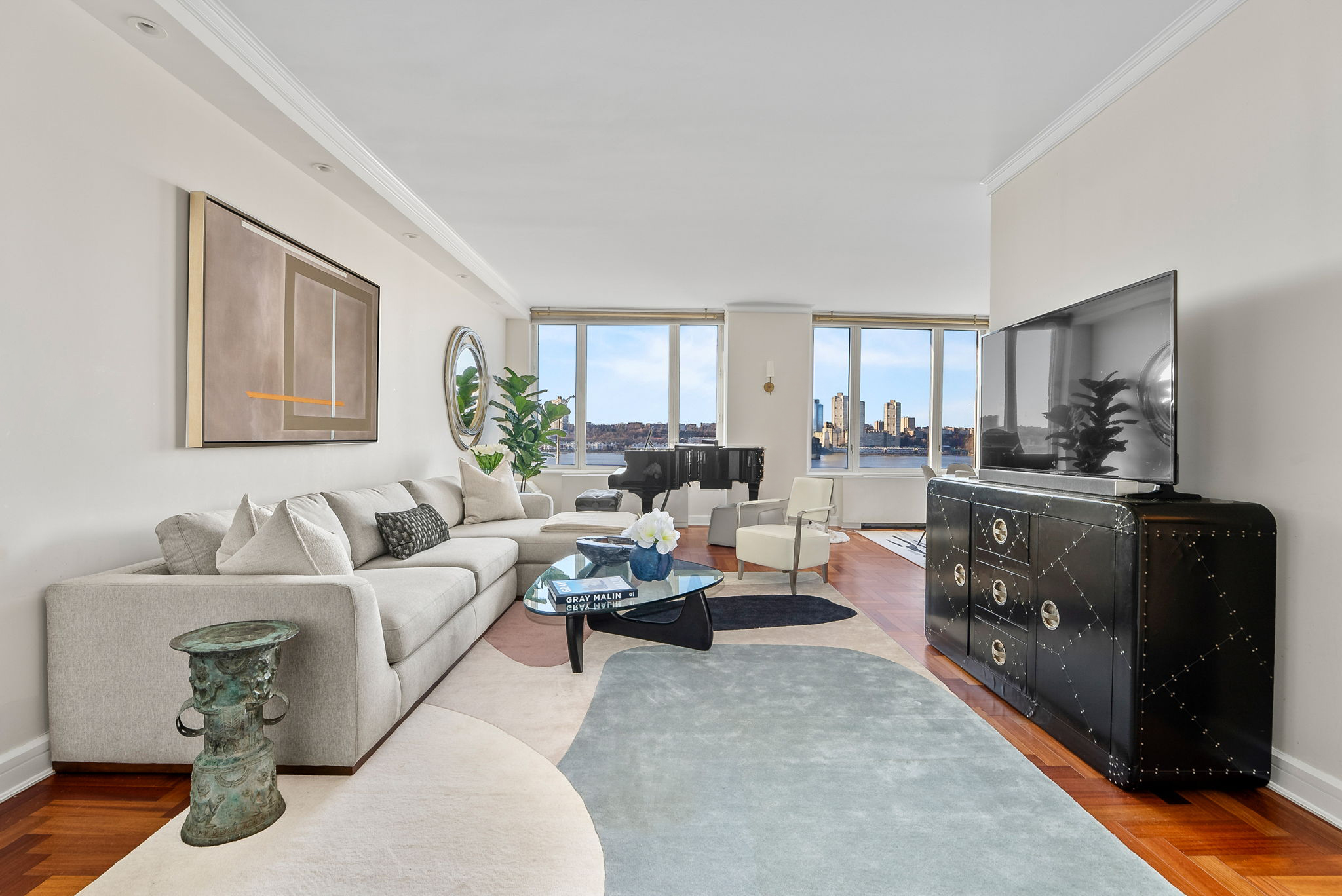 220 Riverside Boulevard, Unit 4M Manhattan, NY 10069 - Photo 2 of 11 a living room with furniture and a fireplace