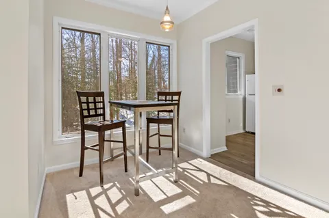 a view of a livingroom with furniture and window