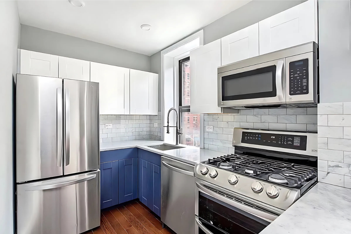 201 West 80th Street, Unit 4W Manhattan, NY 10024 - Photo 6 of 11 a kitchen with stainless steel appliances a refrigerator stove and microwave