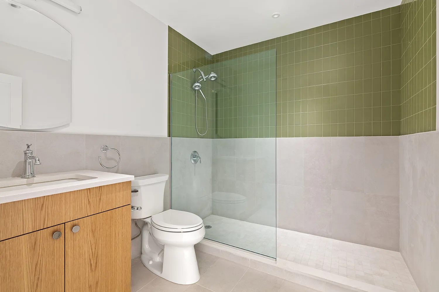 a bathroom with a toilet a sink and shower