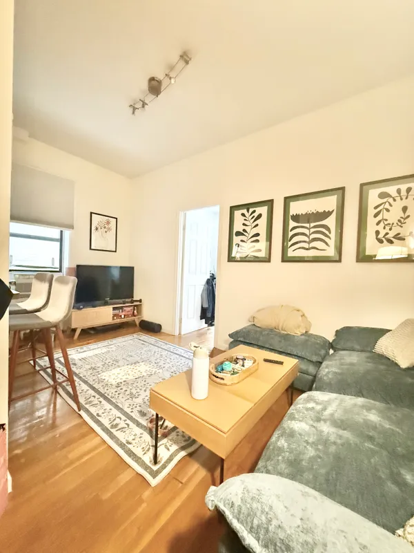 a living room with furniture and a table