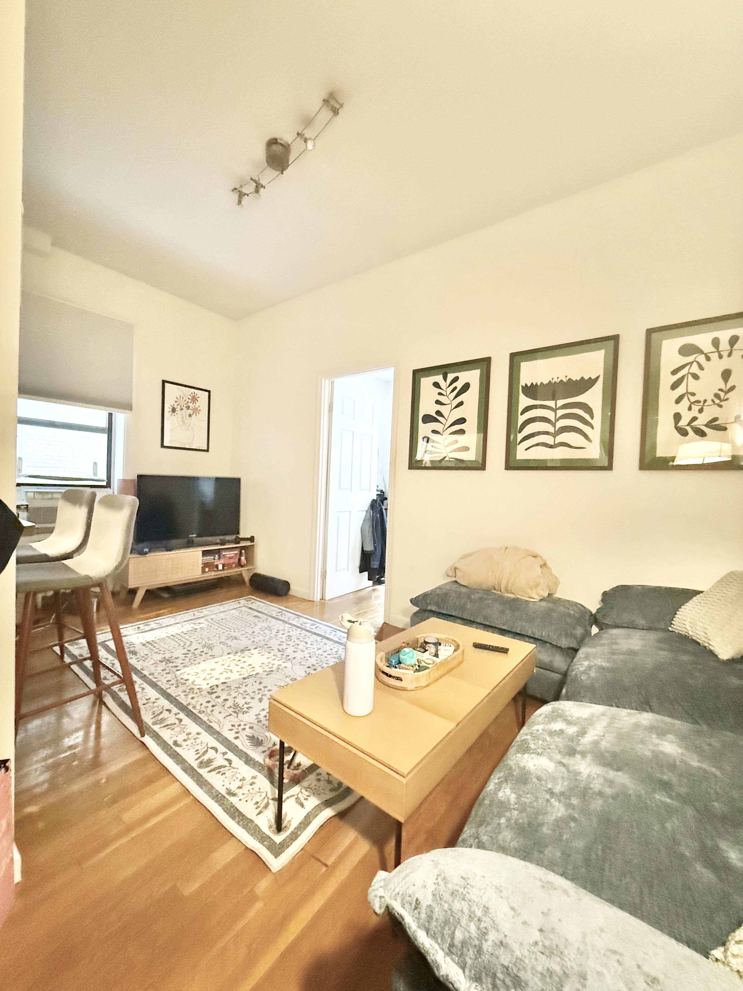 a living room with furniture and a table