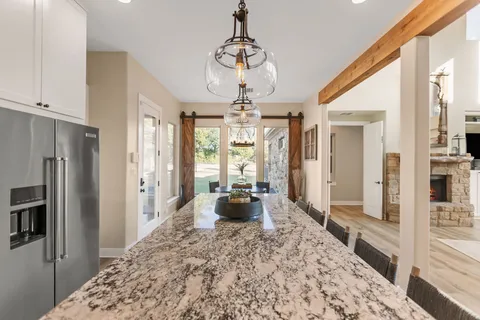 a living room with furniture and a night stand