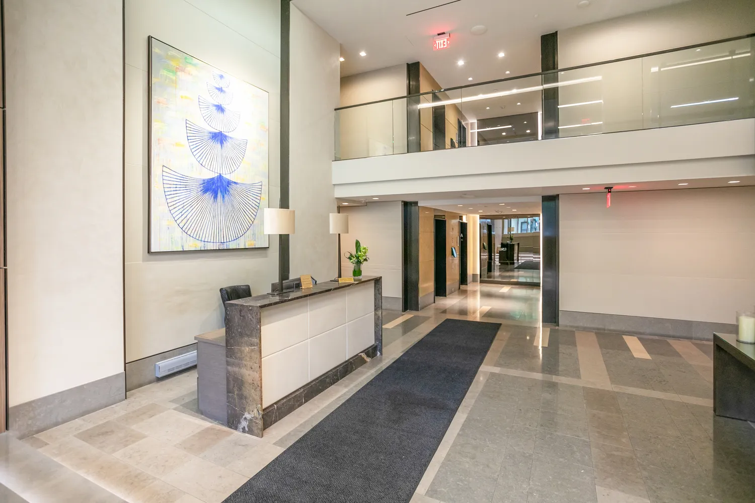 a lobby with furniture and floor