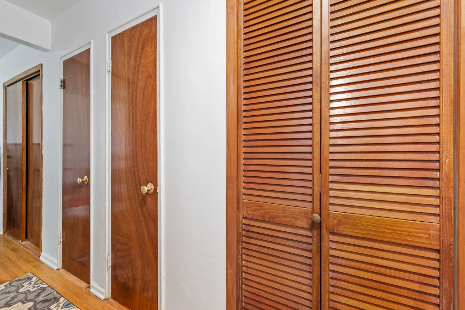 a view of a room with a door and a window