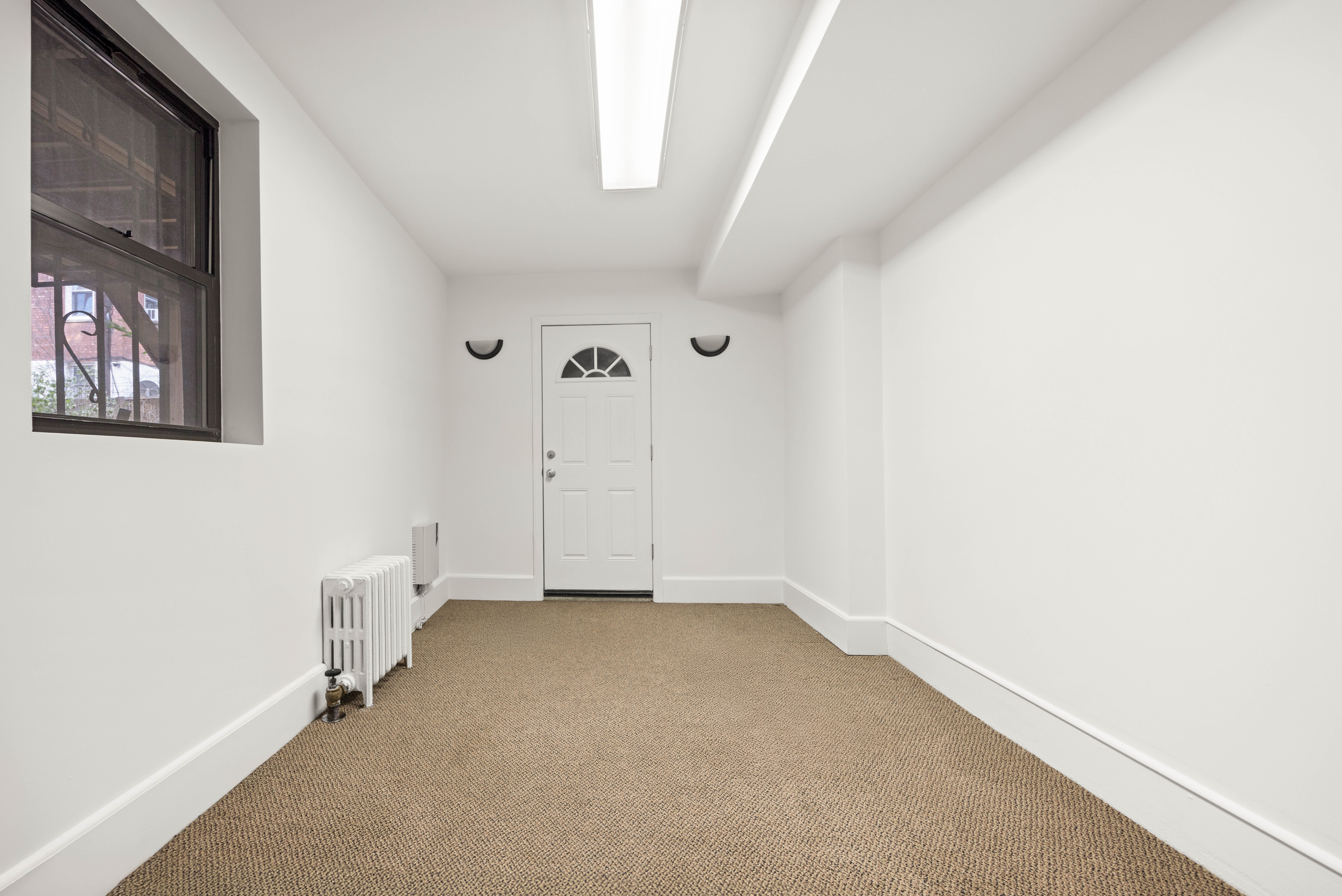 37 8th Avenue, Unit 1 Brooklyn, NY 11217 - Photo 4 of 7 a view of an empty room with a window