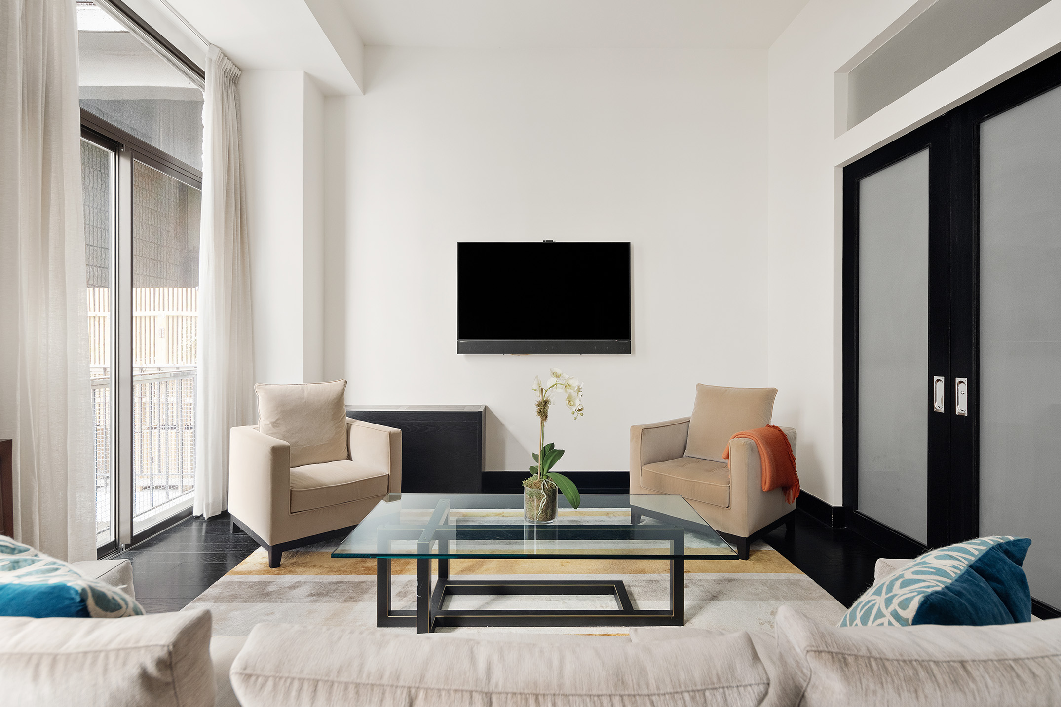 Park Ave S, Unit 7PR Manhattan, NY 10010 - Photo 4 of 15 a living room with furniture and a flat screen tv