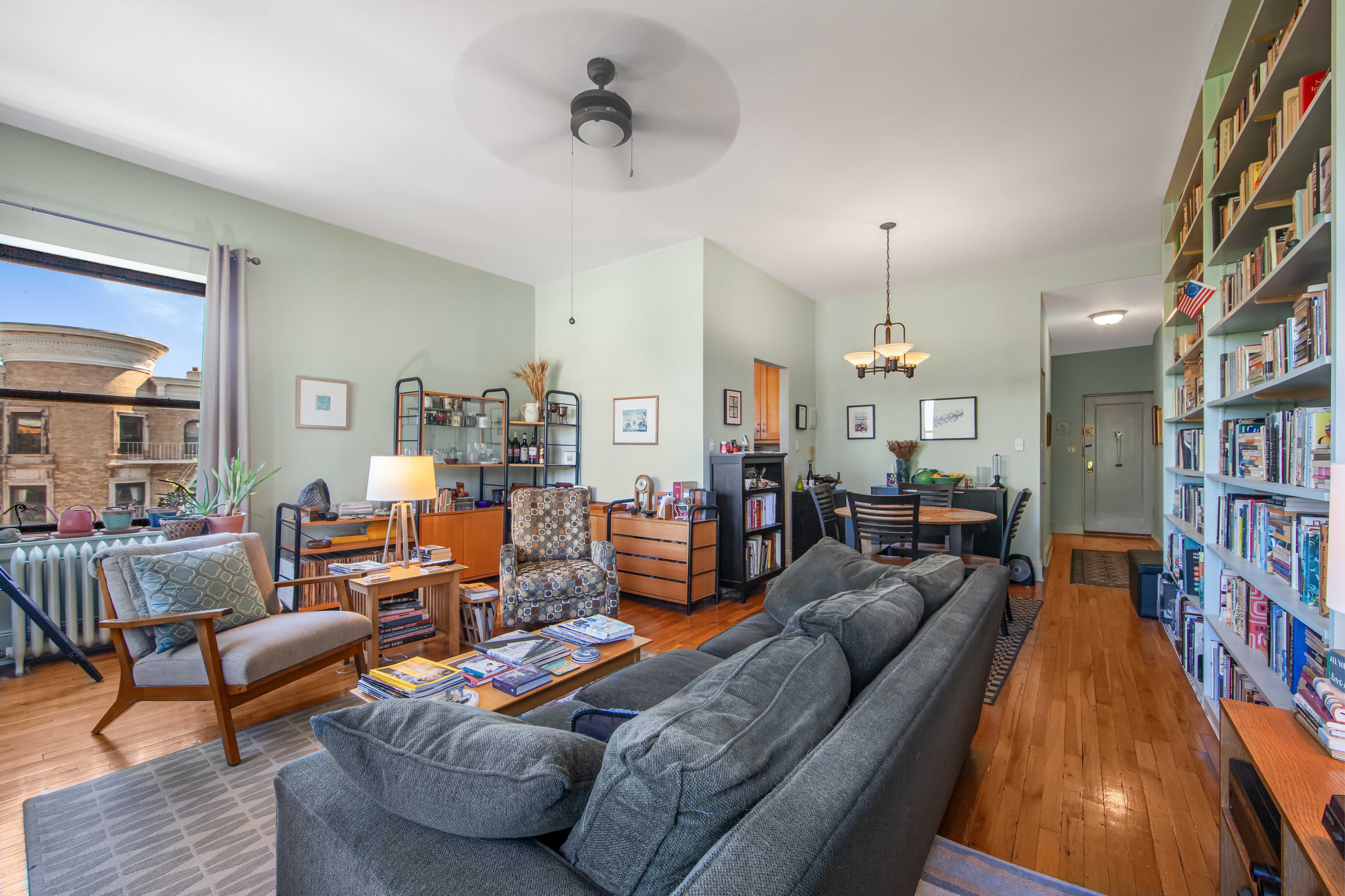 254 Park Place, Unit 4B Brooklyn, NY 11238 - Photo 2 of 12 a living room with furniture and a wooden floor