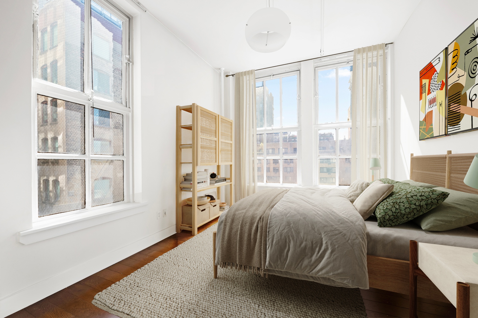 12 West 17th Street, Unit 9 Manhattan, NY 10011 - Photo 7 of 9 a bedroom with a bed and a window