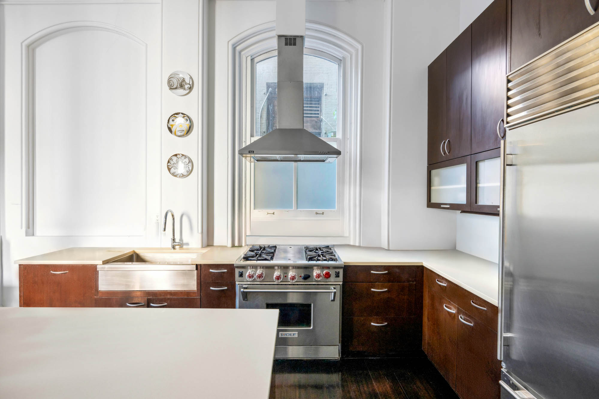 8 Thomas Street, Unit 2 Manhattan, NY 10007 - Photo 2 of 9 a bathroom with a granite countertop sink a vanity and a mirror