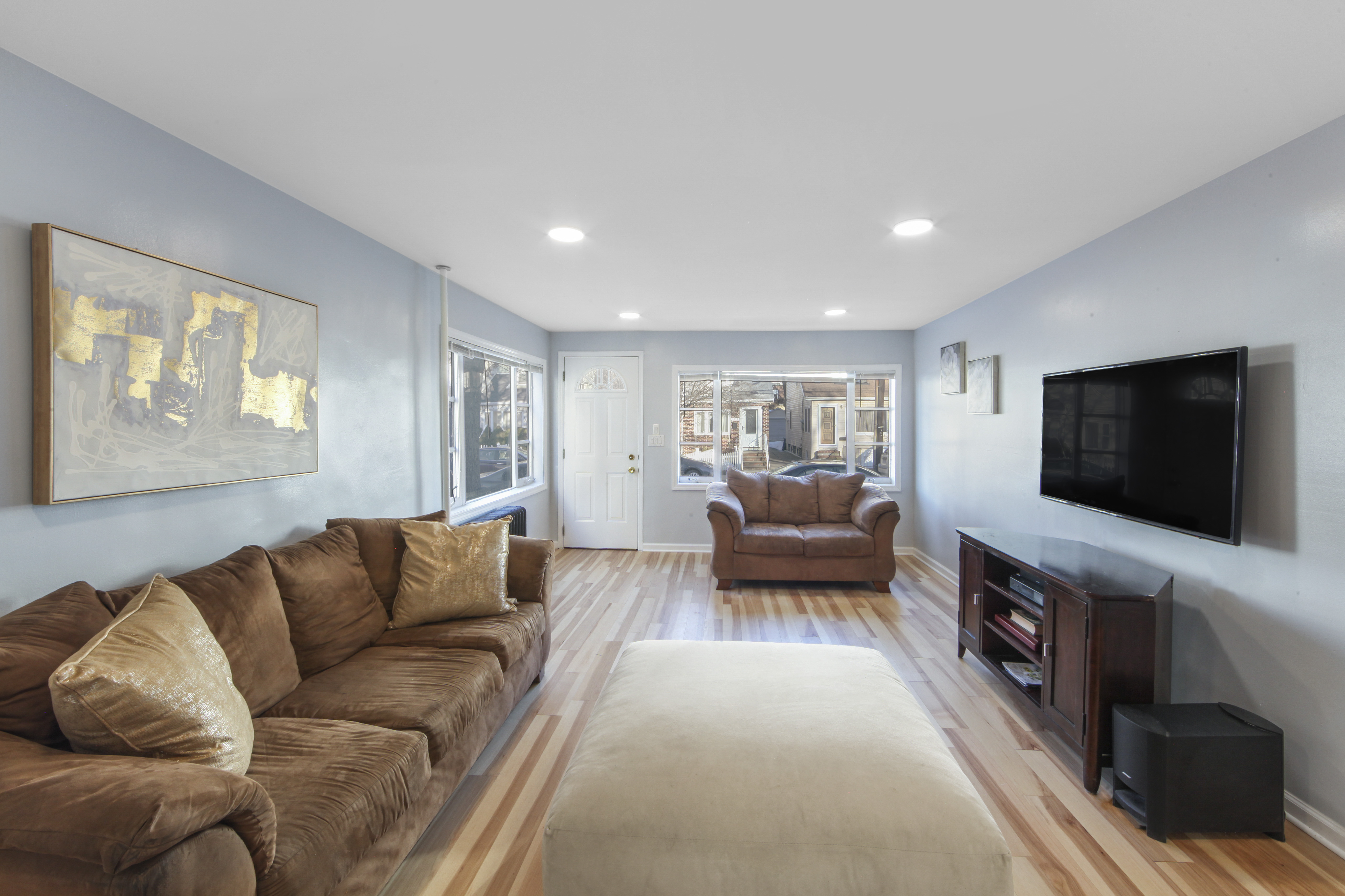 1530 East 51st Street Brooklyn, NY 11234 - Photo 2 of 14 a living room with furniture and a flat screen tv