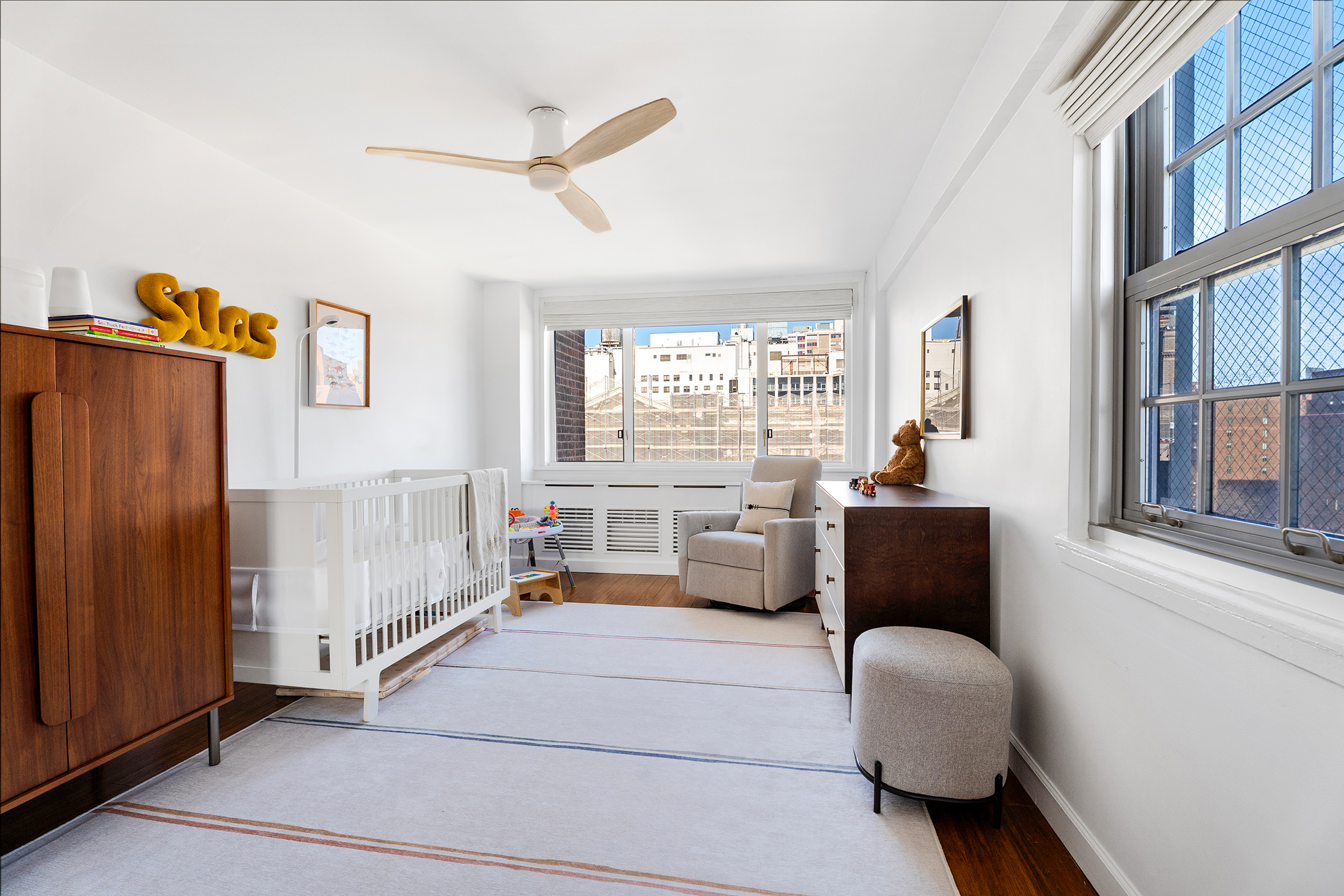 333 East 14th Street, Unit 10D Manhattan, NY 10003 - Photo 5 of 8 a living room with furniture and a window