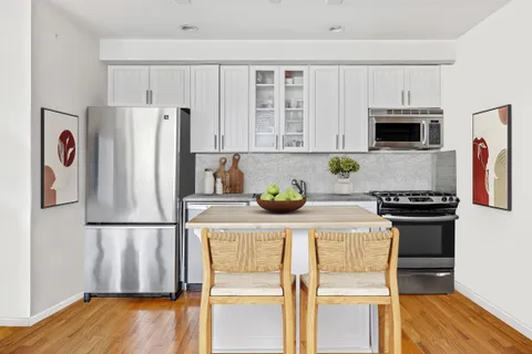 a kitchen with stainless steel appliances granite countertop a refrigerator stove a sink and dishwasher