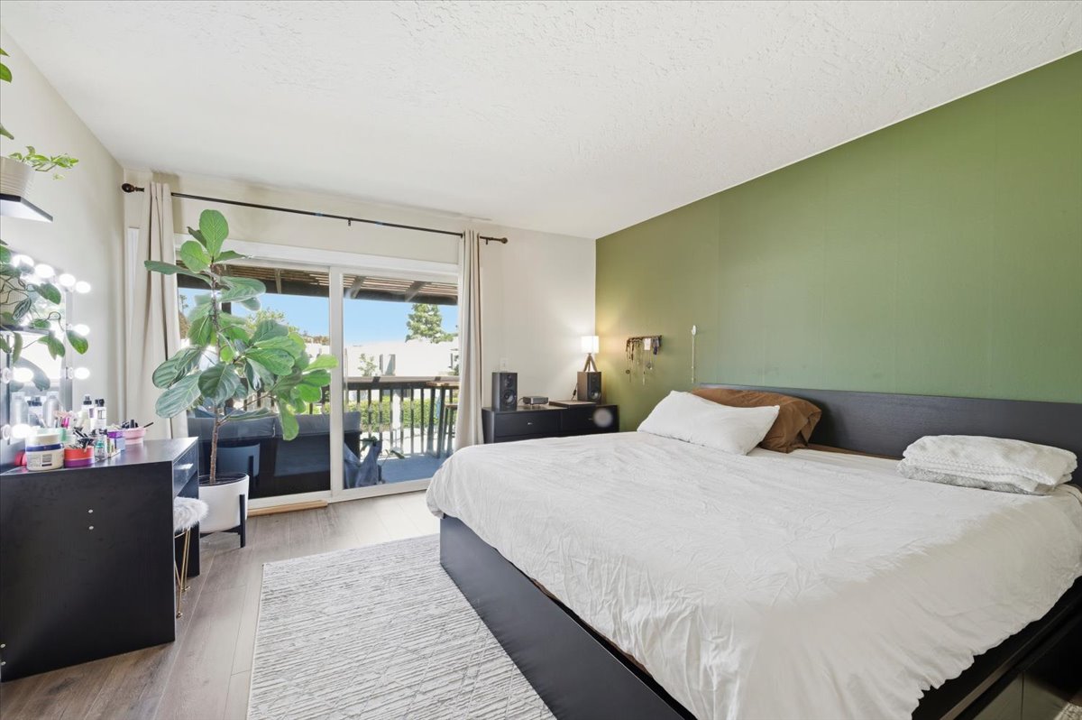 6373 Rancho Mission Road, Unit 5 San Diego, CA 92108 - Photo 5 of 30 a bedroom with a bed and a large window