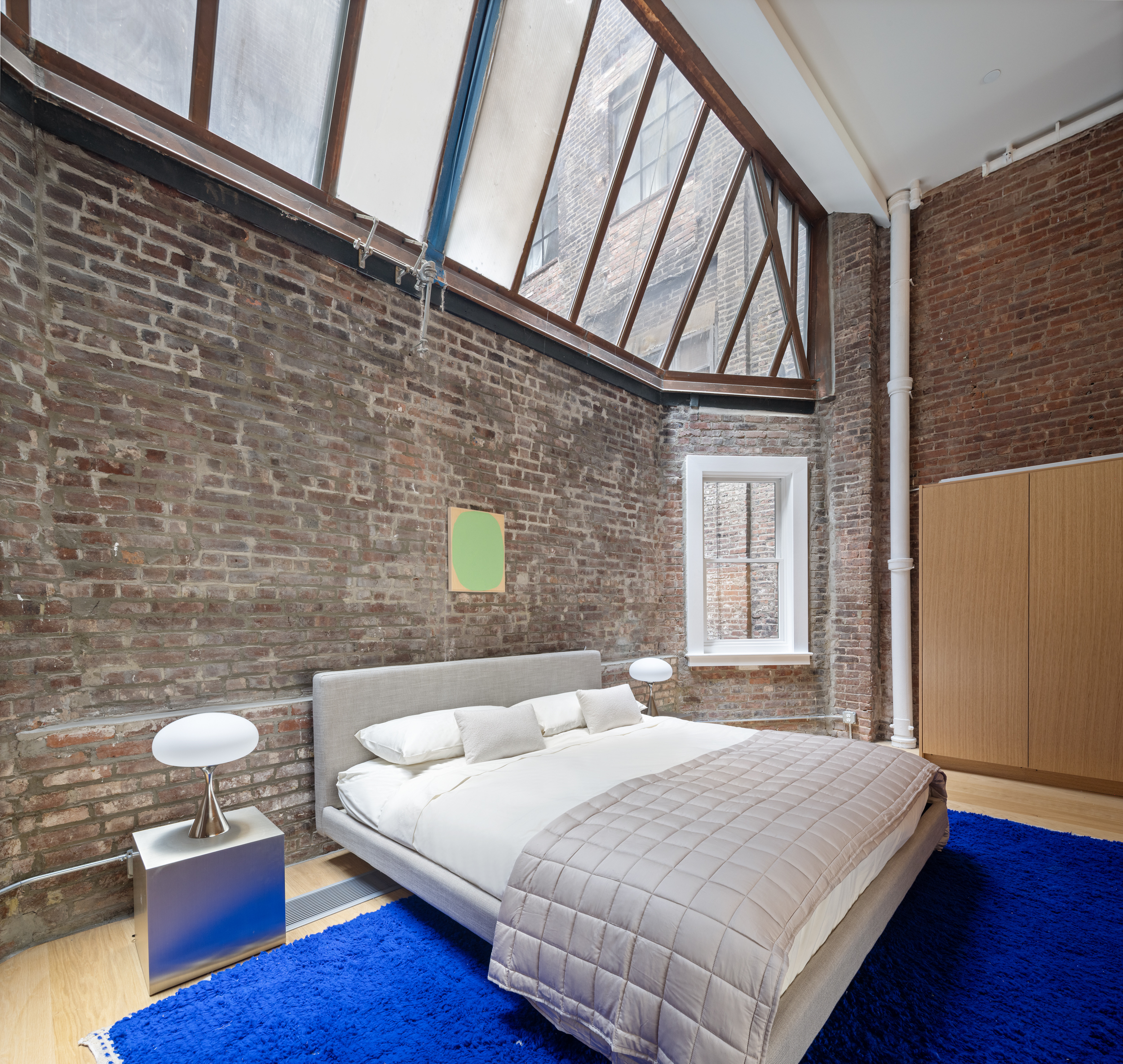 74 Reade Street, Unit 1E Manhattan, NY 10007 - Photo 10 of 22 a bedroom with a bed and a desk