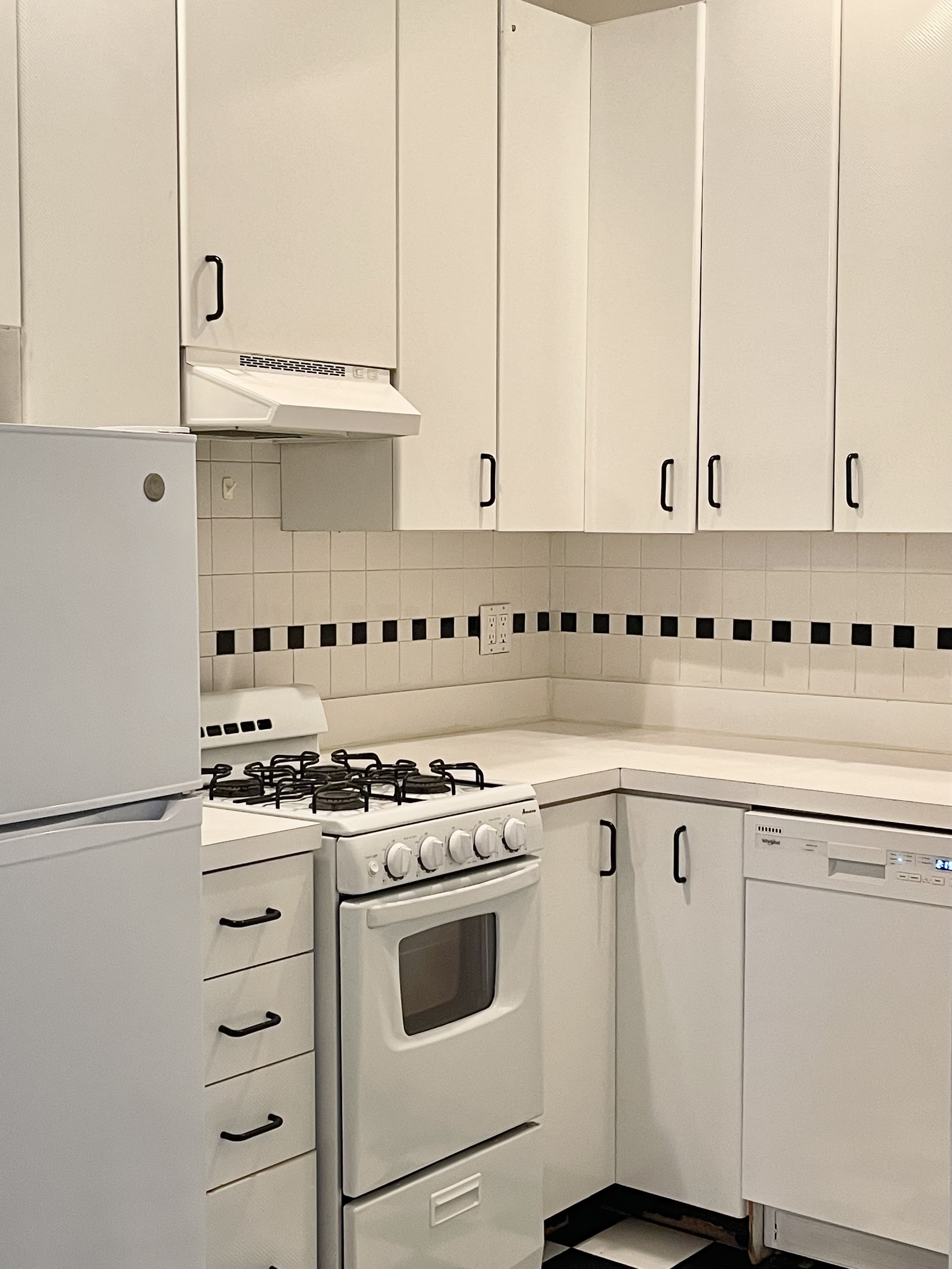 1716 2nd Avenue, Unit 4C Manhattan, NY 10128 - Photo 4 of 13 a kitchen with cabinets appliances and a sink