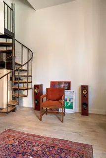 a living room with furniture and a rug