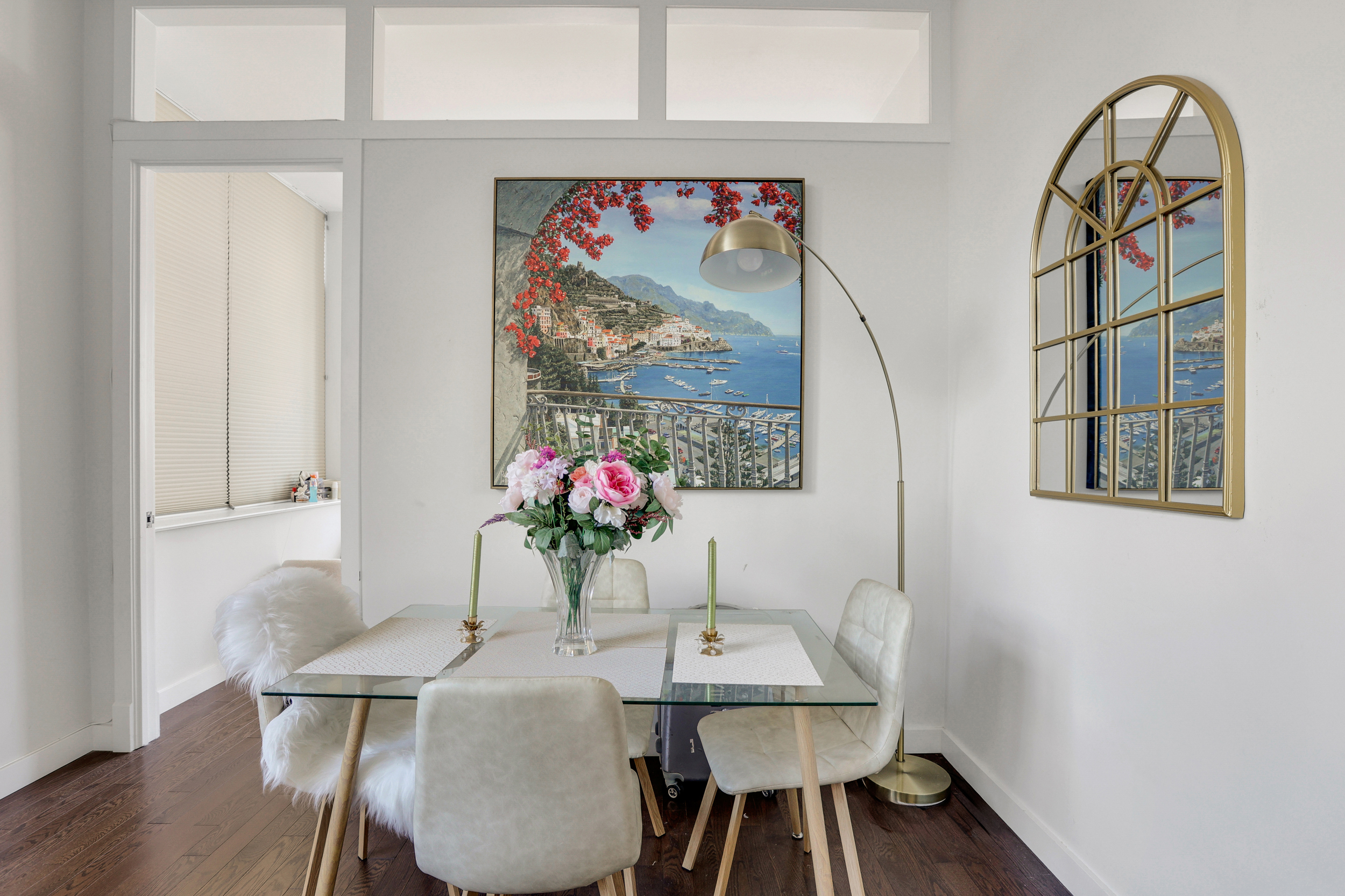 310 East 46th Street, Unit 16B Manhattan, NY 10017 - Photo 3 of 7 a view of a dining room with furniture and a potted plant