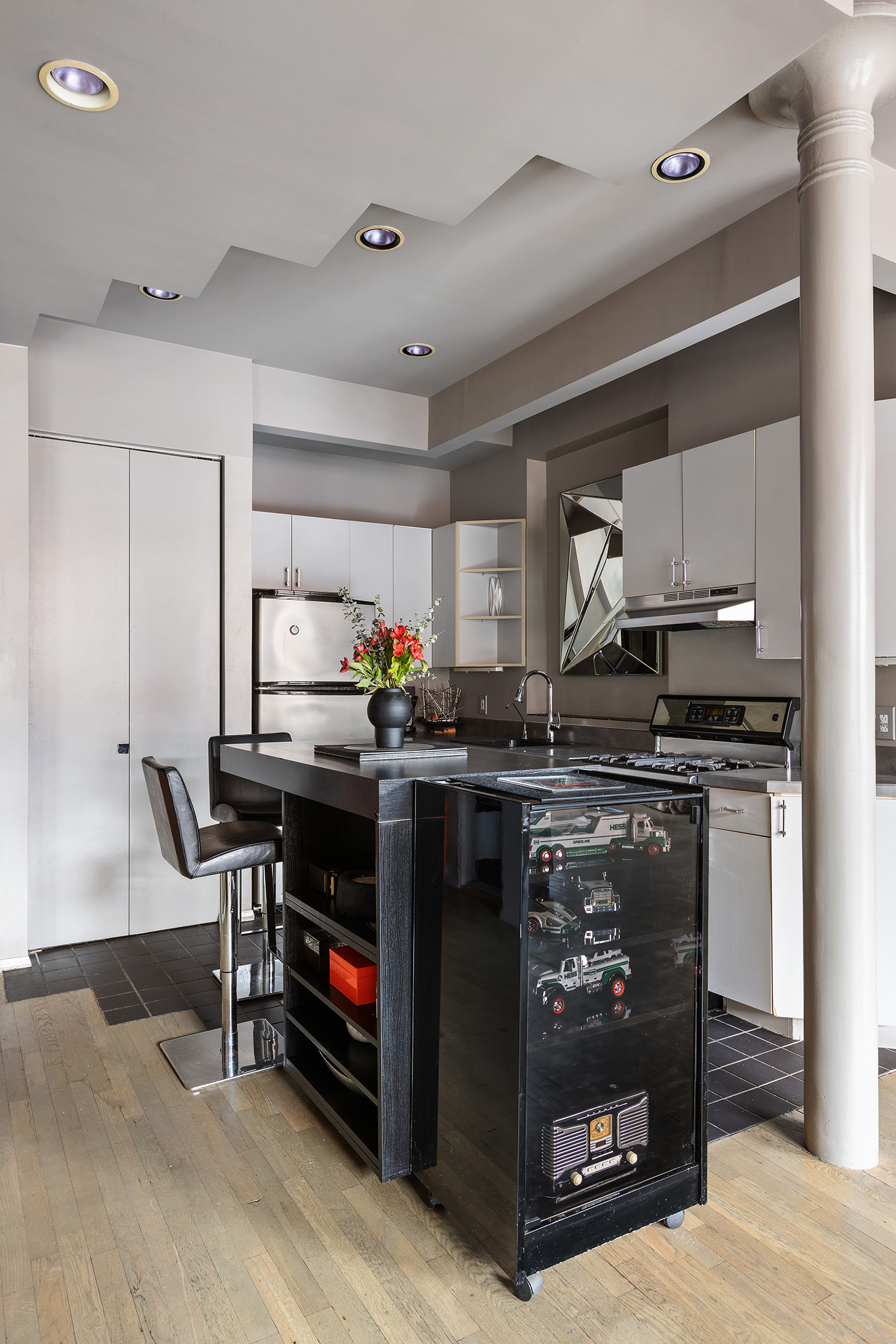 100 West 15th Street, Unit 4BC Manhattan, NY 10011 - Photo 5 of 9 a kitchen with stainless steel appliances granite countertop a stove and a refrigerator