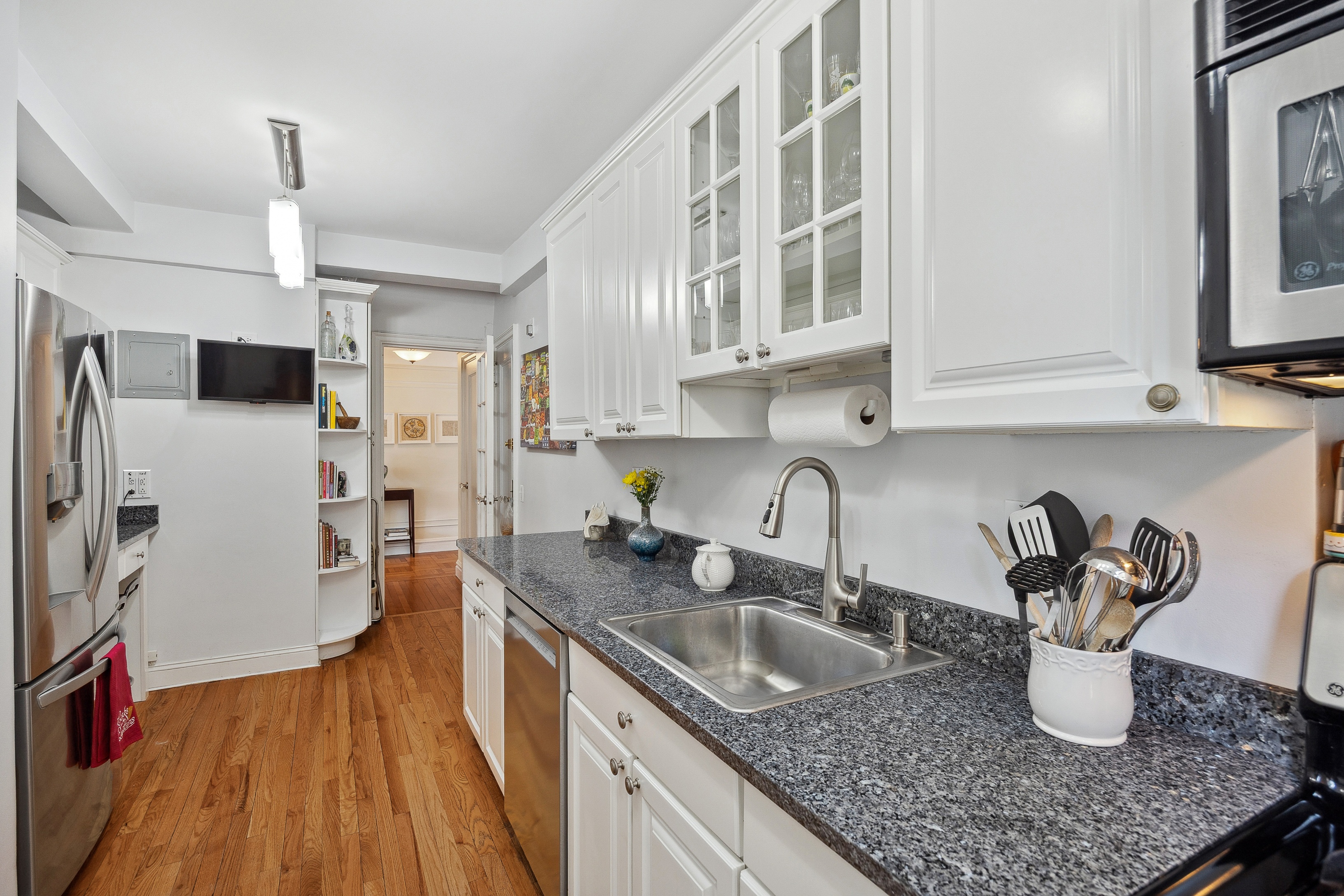 40 West 77th Street, Unit 8C Manhattan, NY 10024 - Photo 7 of 21 a kitchen with sink and refrigerator
