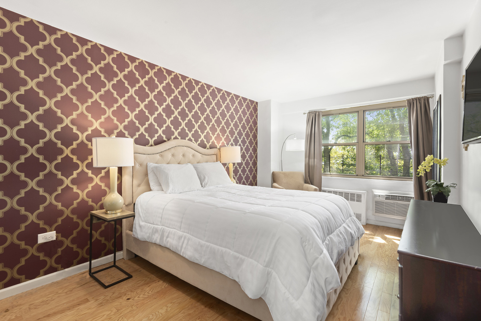 Brooklyn, NY 11207 - Photo 3 of 6 a bedroom with a bed and a lamp next to a window