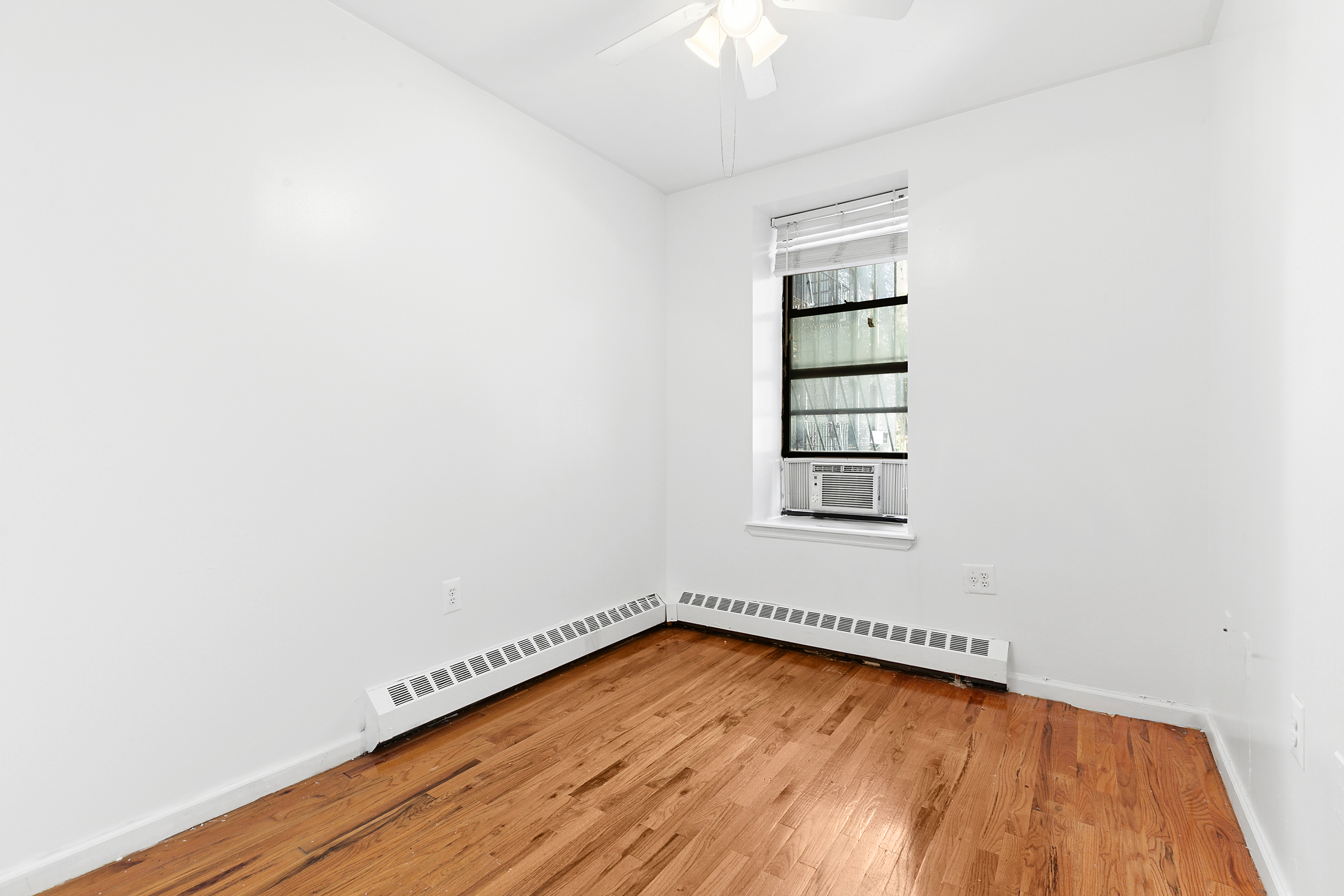418 West 129th Street, Unit 4 Manhattan, NY 10027 - Photo 8 of 15 an empty room with a hardwood and hardwood floor