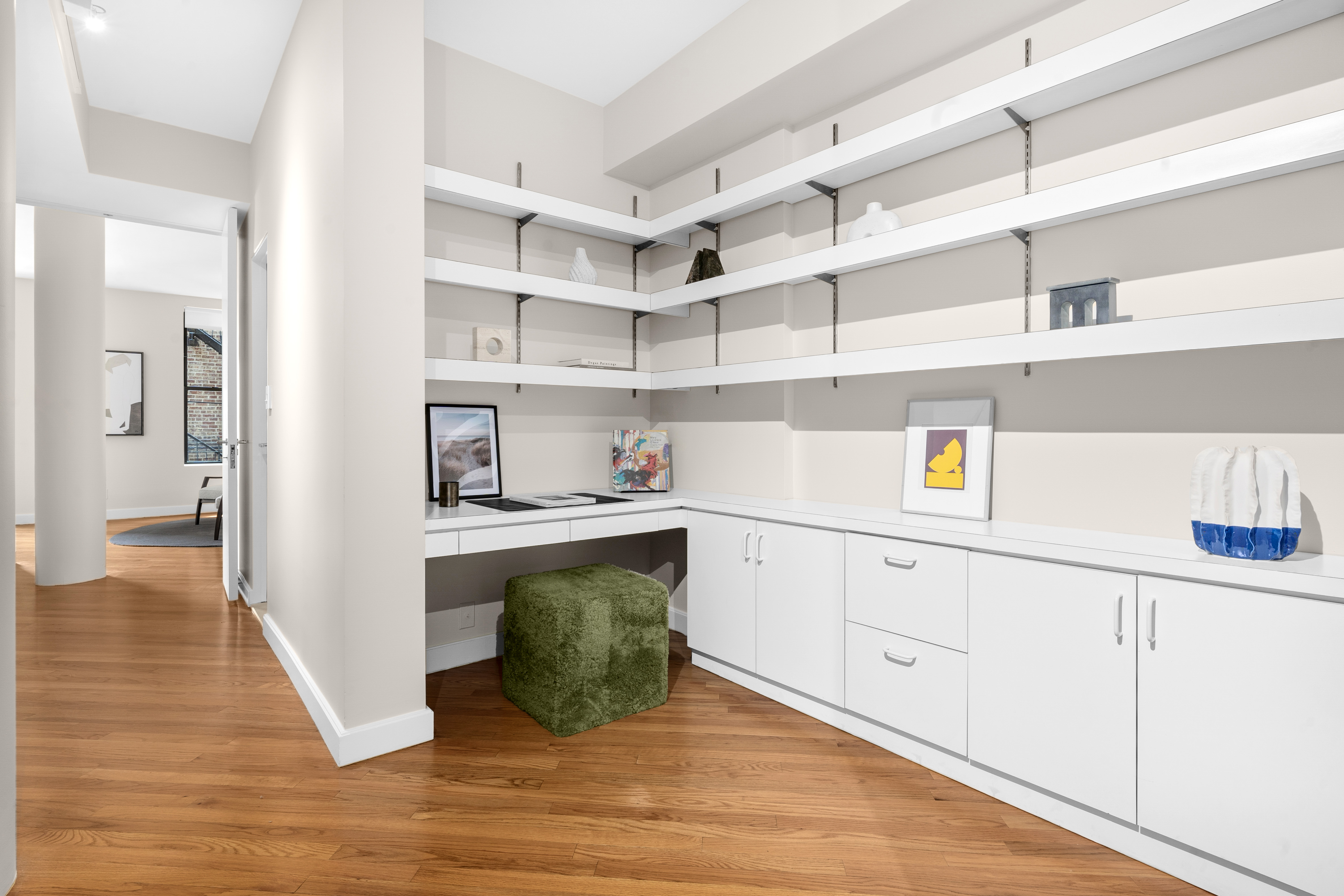 27 East 22nd Street, Unit F4 Manhattan, NY 10010 - Photo 7 of 15 a kitchen with cabinets and wooden floor